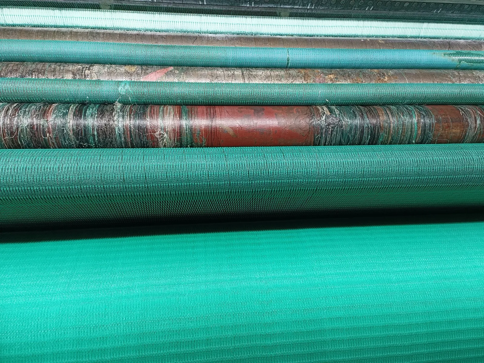 Green shade net rolls on the production line at the OMB Changzhou factory